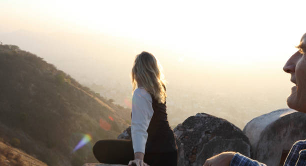 istock Mature couple look off from castle wall at sunrise 1209345767