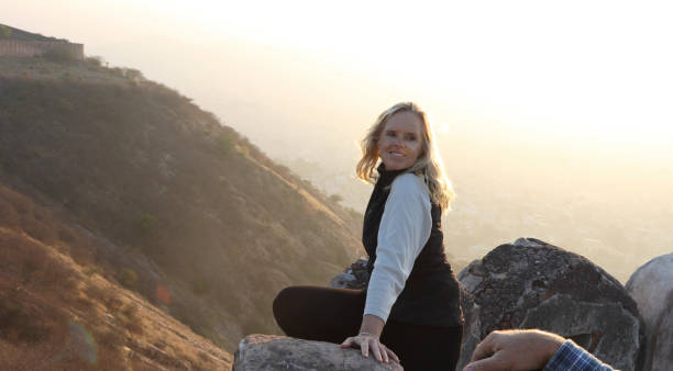 istock Mature couple look off from castle wall at sunrise 1209345779
