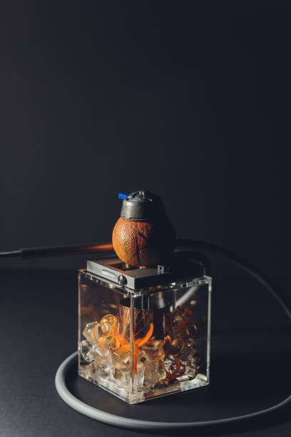 istock Stylish hookah with the aroma grapefruit for relax. grapefruit shisha. Hookah lounge. 1209350058