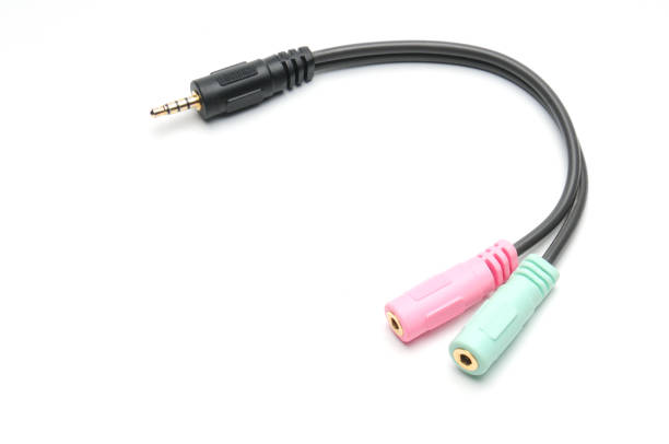 istock Audio video adapter cable with trrs jack to trs connectors on a white background 1209350869