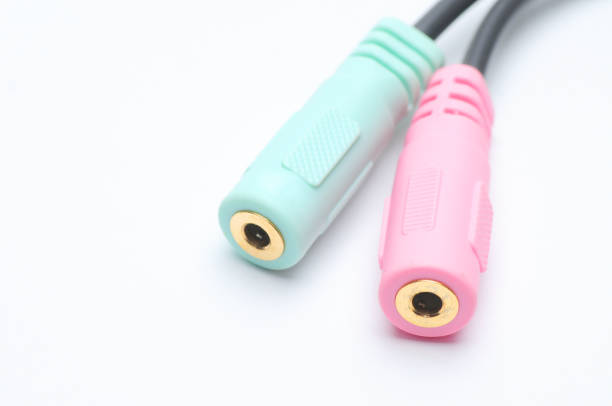 istock Audio video adapter cable with trrs jack to trs connectors on a white background 1209350897
