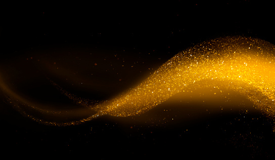 Golden glittering wave over black background