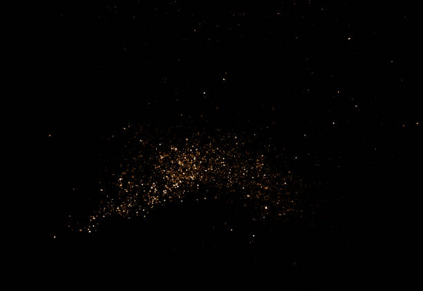 scintille dorate di notte - particella foto e immagini stock