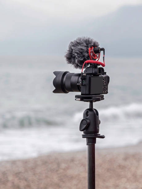 istock DSLR video camera on monopod on the beach 1209352809