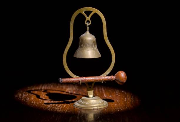istock vintage hand made hanging brass meditation bell in spotlight 1209352943