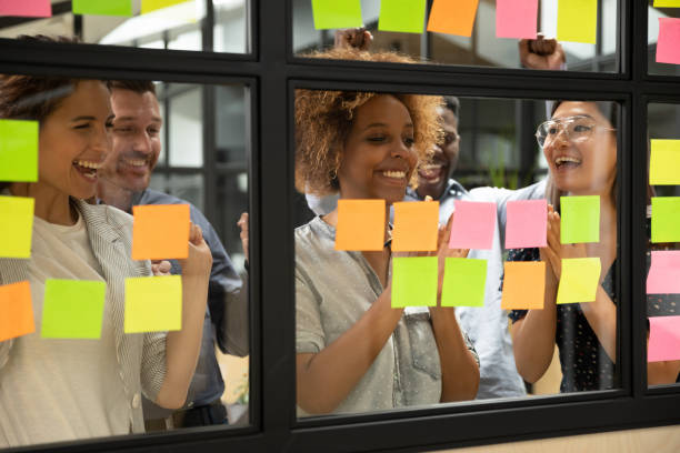 istock Excited multiethnic team celebrate successful project complete 1209353345