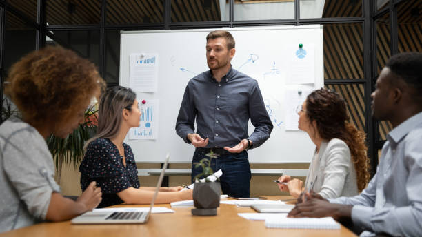 istock Businessman hold team meeting making speech at meeting 1209353355