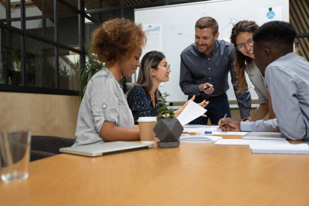 istock Multiethnic businesspeople brainstorm discussing ideas at team briefing 1209353356