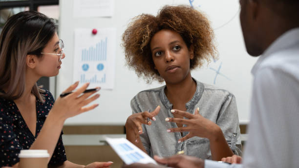 istock Multiethnic diverse colleagues brainstorm at company briefing 1209353368