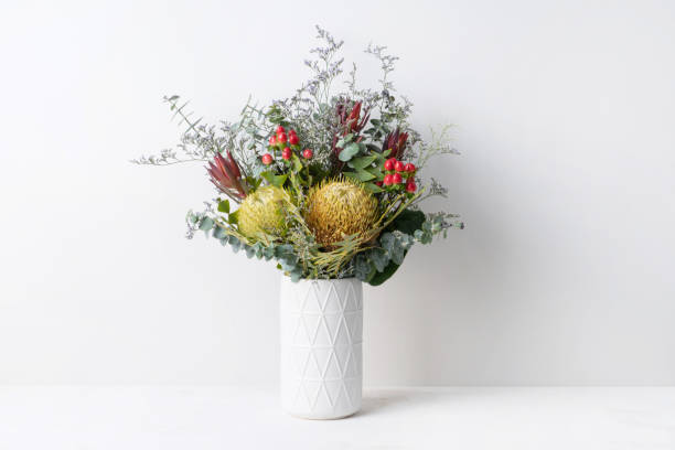 istock A bunch of mostly Australian native flowers in a white vase. 1209362375