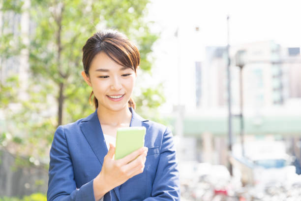 istock asian woman who see a smart phone 1209365853