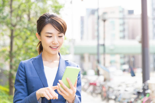 istock asian woman who see a smart phone 1209365878