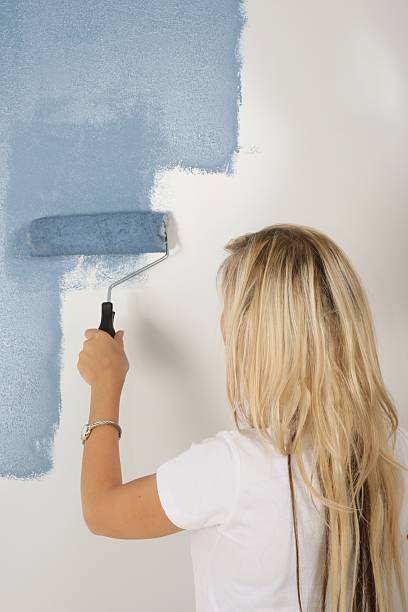 istock Lady Painting House 120936950