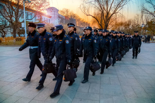 Chinese police troop patrol at Tiananmen Square in Beijing, China Beijing, China - Jan 17 2020: Unidentified group of  Chinese police troop patrol at Tiananmen Square prc stock pictures, royalty-free photos & images