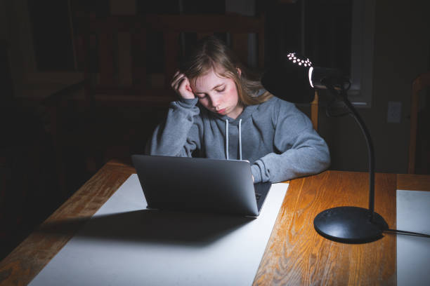 istock Stressed teen girl working/studying. 1209374220