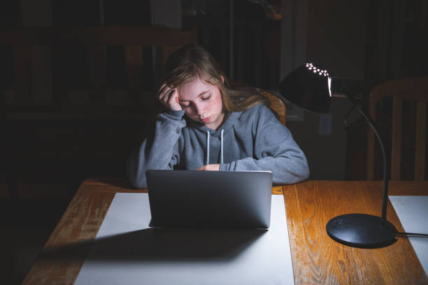 istock Stressed teen girl working/studying. 1209374311