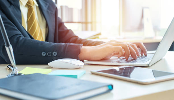 istock Asian business man hands typing on laptop computer keyboard 1209376722
