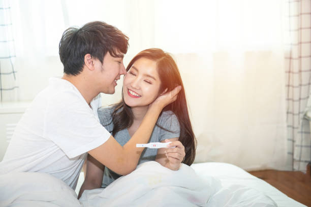 https://media.istockphoto.com/id/1209377530/photo/cheerful-and-happy-young-asian-man-and-woman-with-positive-pregnancy-test-holding-in-hand.jpg?s=612x612&w=0&k=20&c=ByxzdF090F3fiuQd-v8xAfVLBTWcMYxp4J3BcbveWXk=