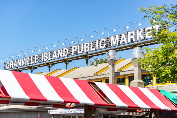 Granville Island Public Market the place to pick up fruit, vegetables and that tasty treat. Granville Island, British Columbia / Canada - 06/15/2015 Granville Island Public Market the place to pick up fruit, vegetables and that tasty treat. granville island stock pictures, royalty-free photos & images