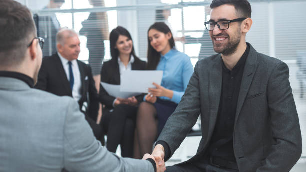istock close up. business people shaking hands in agreement 1209386713