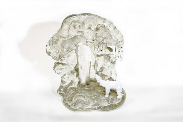 istock An ancient sculpture of a polar bear in ice on a white background. 1209388476