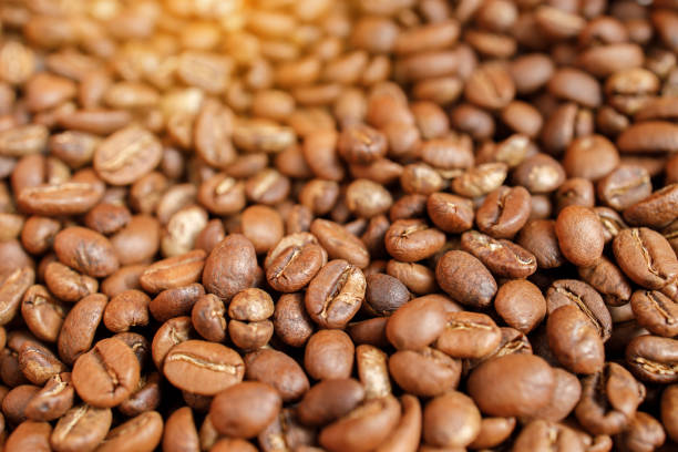 istock roasted coffee beans in bowl on wooden 1209389330