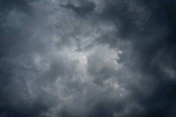 istock Dark black clouds in the sky, Stormy rain clouds background. 1209393770