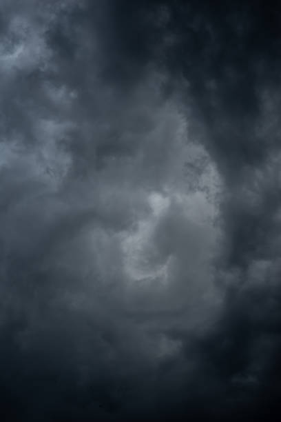istock Dark black clouds in the sky, Stormy rain clouds background. 1209393852