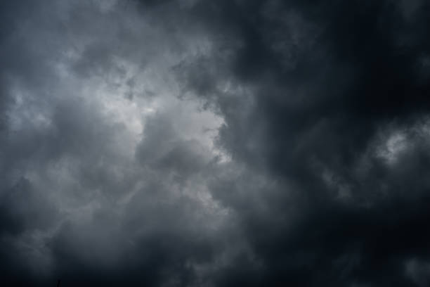 istock Dark black clouds in the sky, Stormy rain clouds background. 1209393862