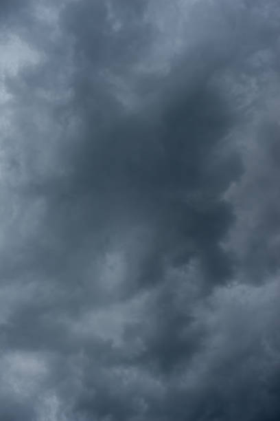 istock Dark black clouds in the sky, Stormy rain clouds background. 1209393957