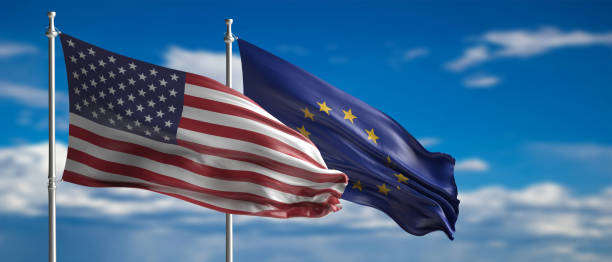 istock EU and America waving flags on blue sky. 3d illustration 1209401017