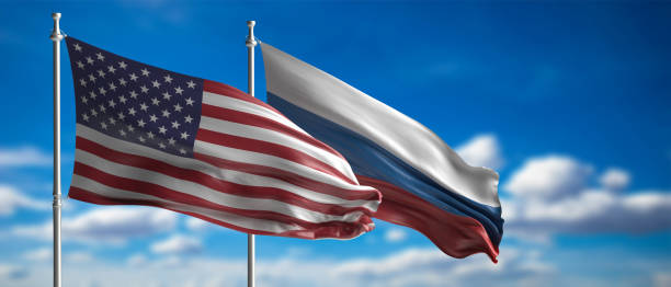 istock Russia and America waving flags on blue sky. 3d illustration 1209401022