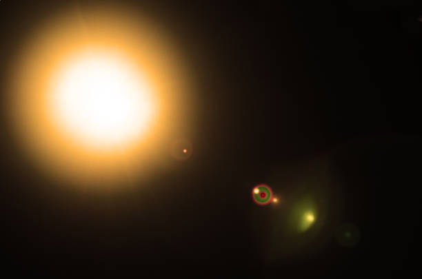 istock Abstract Natural Sun flare or Far star on the black background 1209402301