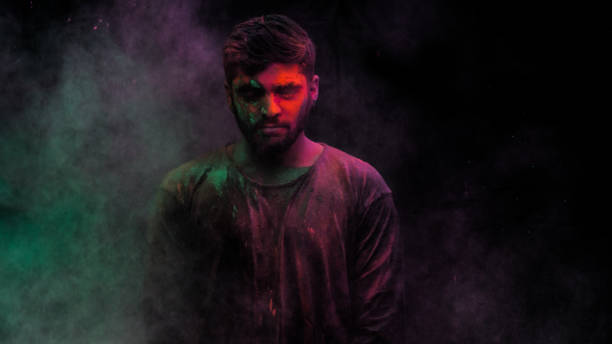 istock man in holi colors 1209402343