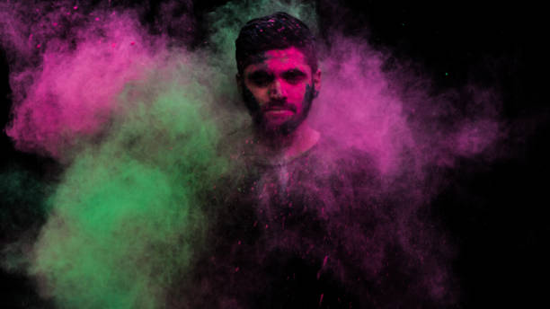 istock man in holi colors 1209403411