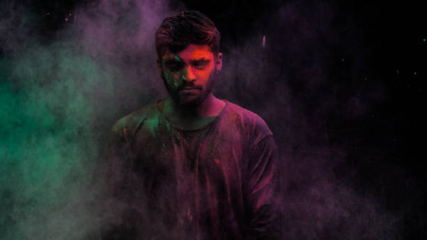 istock man in holi colors 1209403646