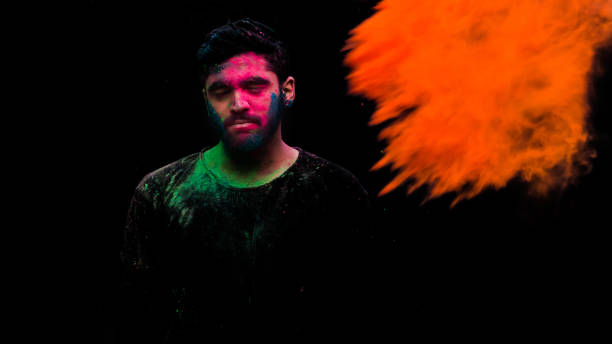istock man in holi colors 1209403780
