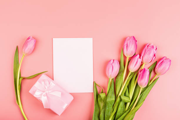istock View from above tulips and gift box with copy space. Background for womens day, 8 March Valentines day, 14 february. Flat lay style, top view, mockup, template, overhead. Greeting card 1209406813