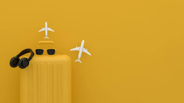 istock Suitcase, Minimal Travel Concept on yellow background 1209407924