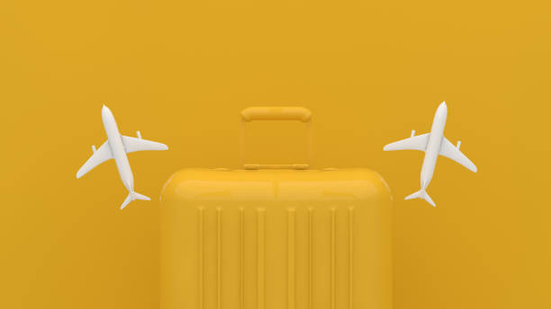 istock Suitcase, Minimal Travel Concept on yellow background 1209408748