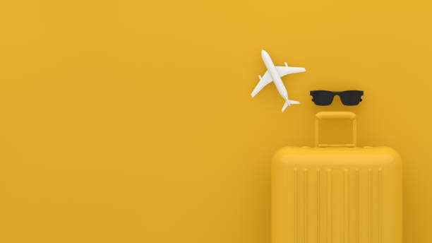 istock Suitcase, Minimal Travel Concept on yellow background 1209409394