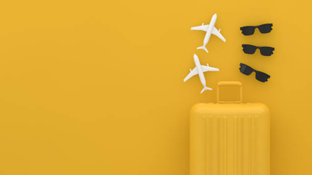 istock Suitcase, Minimal Travel Concept on yellow background 1209409508