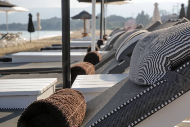 istock Luxurious sunbeds and umbrellas on a sandy beach 1209409565
