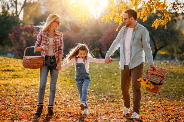 istock Happy family resting in summer park 1209413259