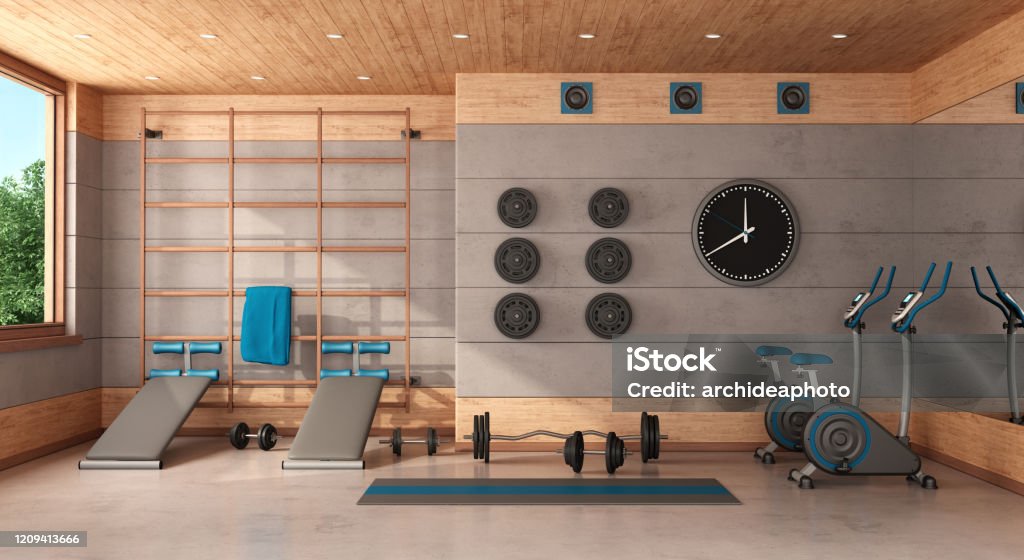Home gym in a concrete and wooden room Home gym with Swedish  wall, bench, bicycle and weights - 3d rendering Gym Stock Photo