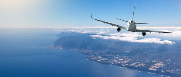 istock Back view of commercial airplane 1209414973