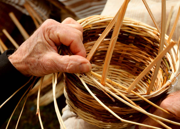 istock Hand of senior and wicker basket 1209417329