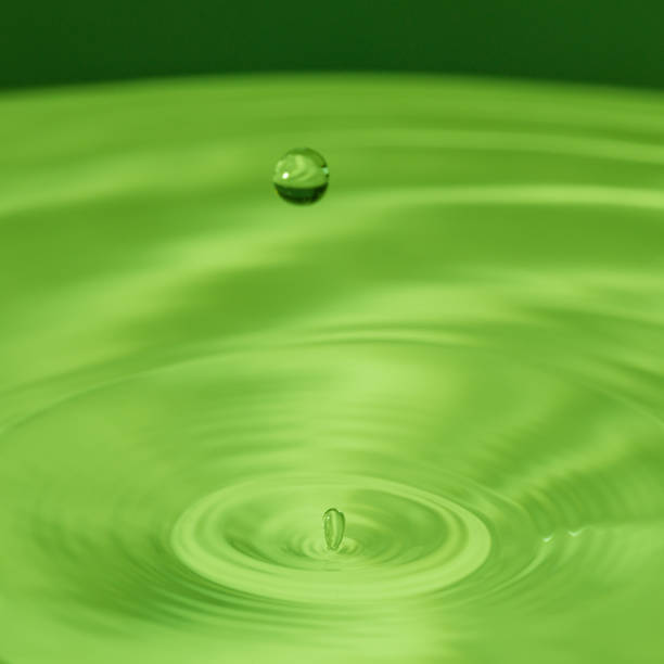 istock water drop bouncing on the surface of more water 1209417840