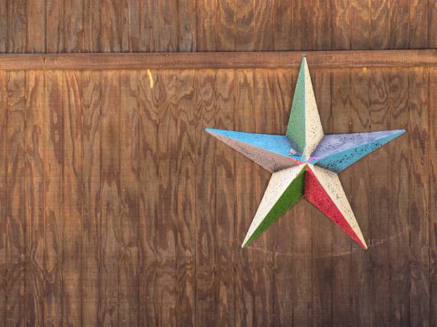 istock Metalic Star Shap on Wooden Wall 1209419236