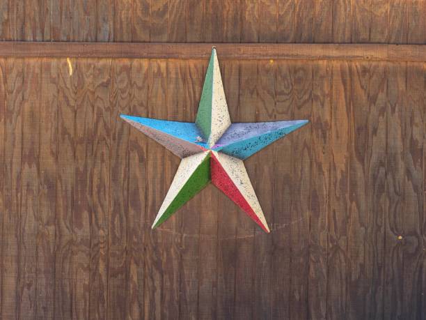 istock Metalic Star Shap on Wooden Wall 1209419270